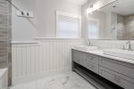 Double vanity in another well designed bathroom 